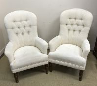 A pair of modern buttoned upholstered armchairs in the Victorian style on turned and ringed