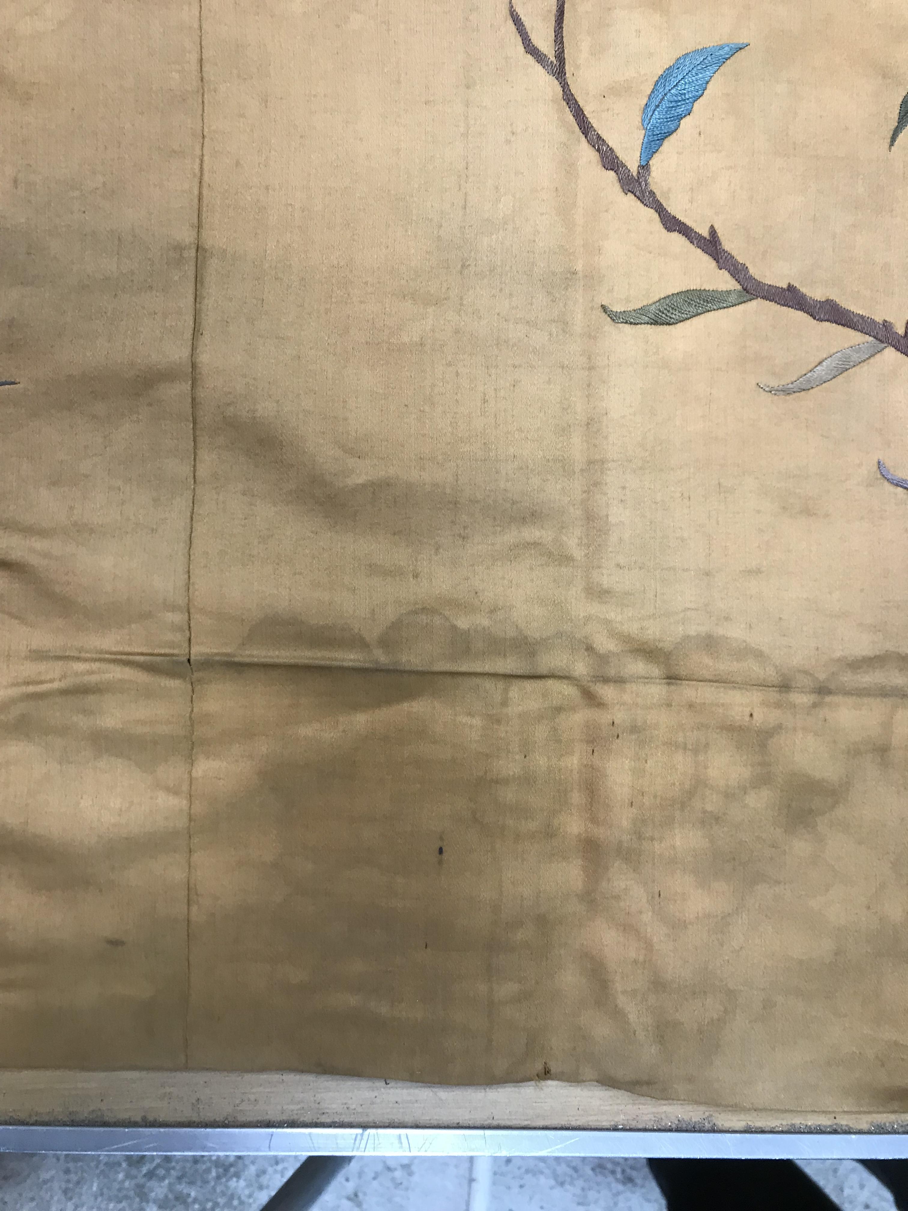 An early 20th Century silk panel set with embroidered floral decoration and Chinese character marks, - Image 8 of 8