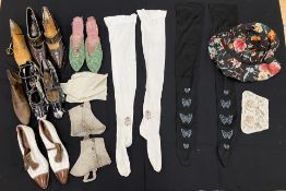 Two pairs of early 20th Century silk stockings, one in black with butterfly sequin embellishments,