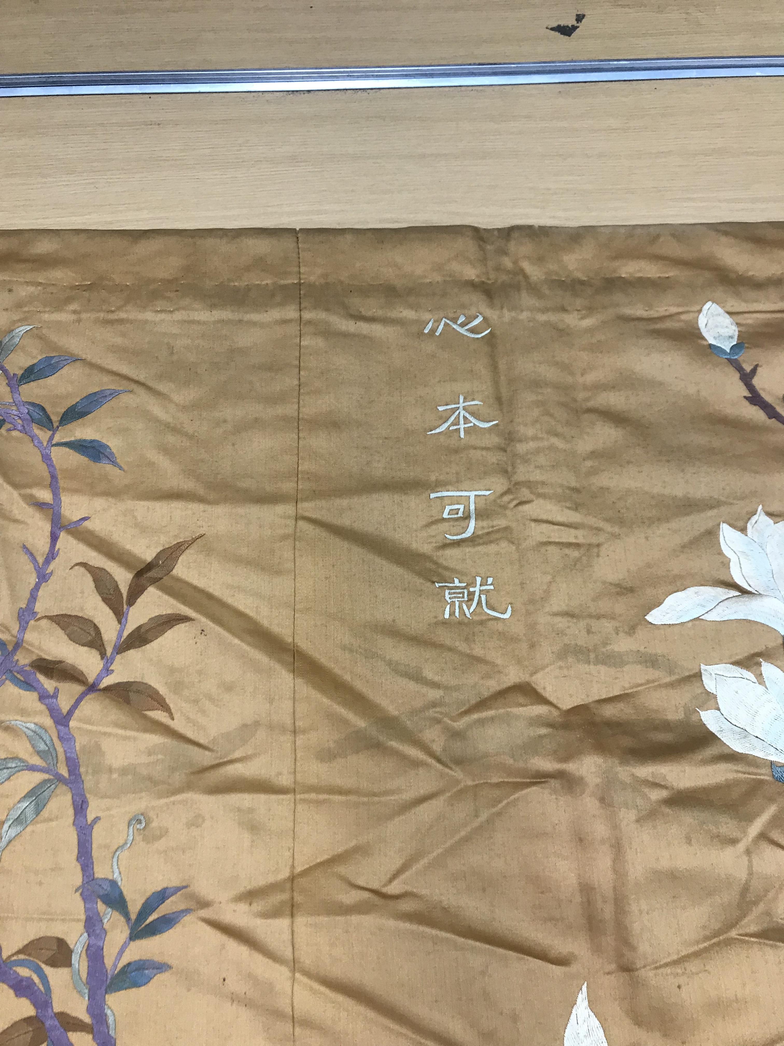 An early 20th Century silk panel set with embroidered floral decoration and Chinese character marks, - Image 6 of 8