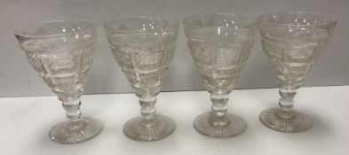 A set of four 19th Century cut glass wines,