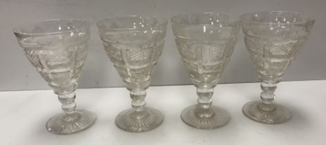 A set of four 19th Century cut glass wines,