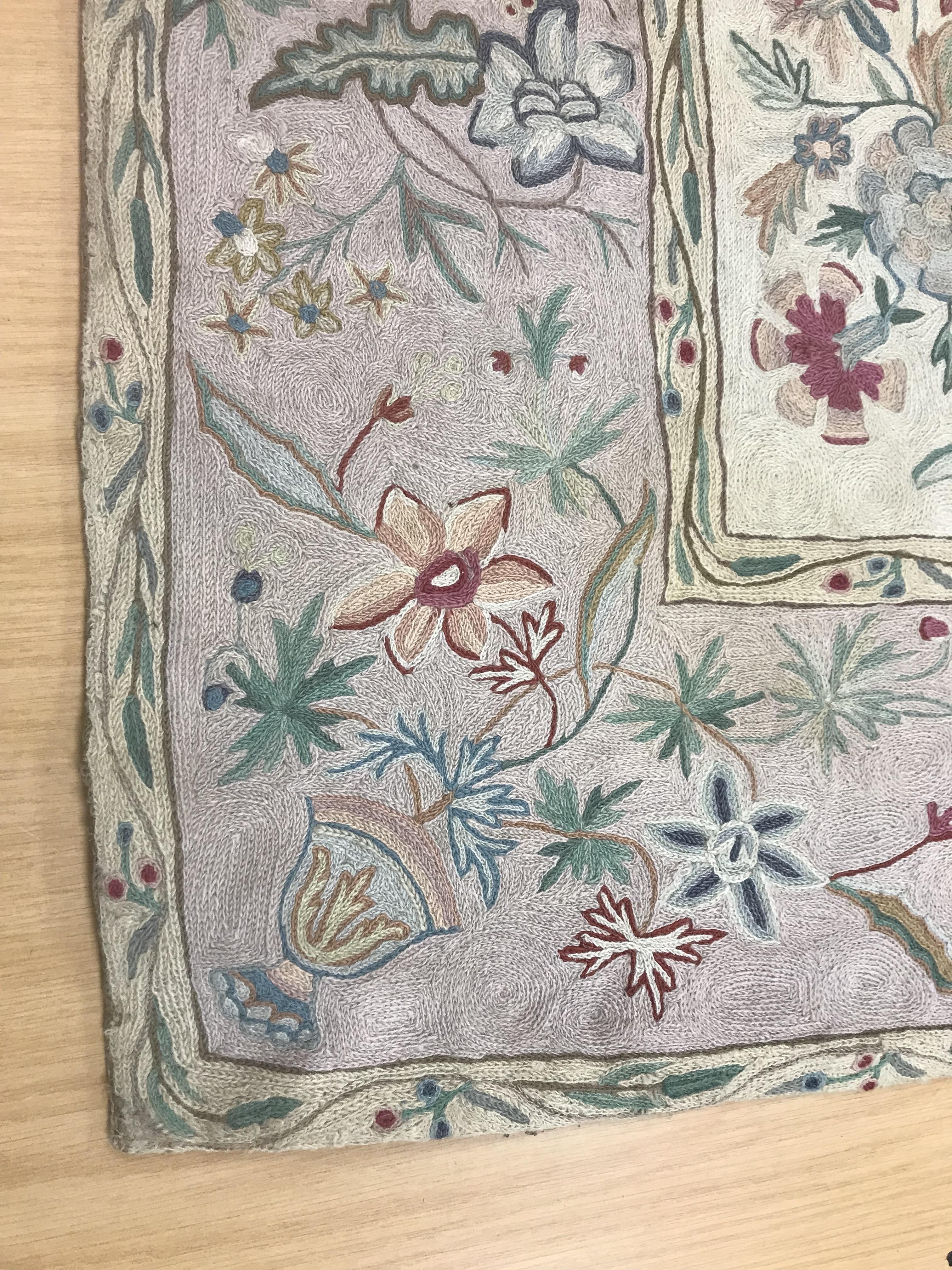 A pair of early 20th Century crewelwork panels with floral decoration on cream and pink grounds, - Image 2 of 21