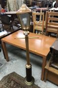 A modern coppered standard lamp as a Victorian street lamp, 160 cm high,