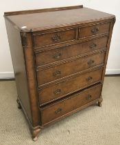 A mid 20th Century burr walnut veneered chest of two short over four long drawers on cabriole legs,