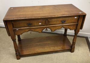 A modern oak two drawer side table in the 18th Century manner,