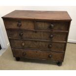 A 19th Century mahogany chest of two short over three long graduated drawers with turned knob