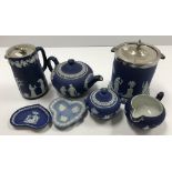A collection of Wedgwood blue Jasper ware with Classical relief decoration including a cylindrical