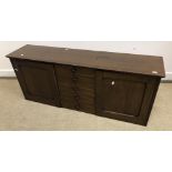 A circa 1900 oak chest, the plain top above five small drawers with turned knob handles,