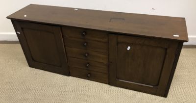 A circa 1900 oak chest, the plain top above five small drawers with turned knob handles,