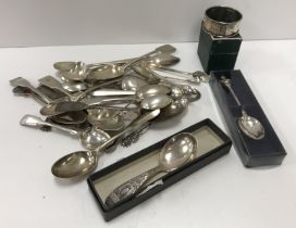 A quantity of silver teaspoons, sugar tongs and a silver napkin ring etc,