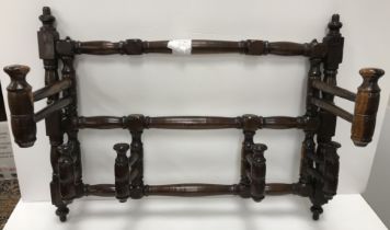 A rare 19th Century laburnum alpinum wall-mounted wig rack of six turned and ringed folding hooks,