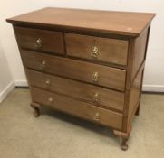 An early 20th Century chestnut chest of two short over three long graduated drawers with later
