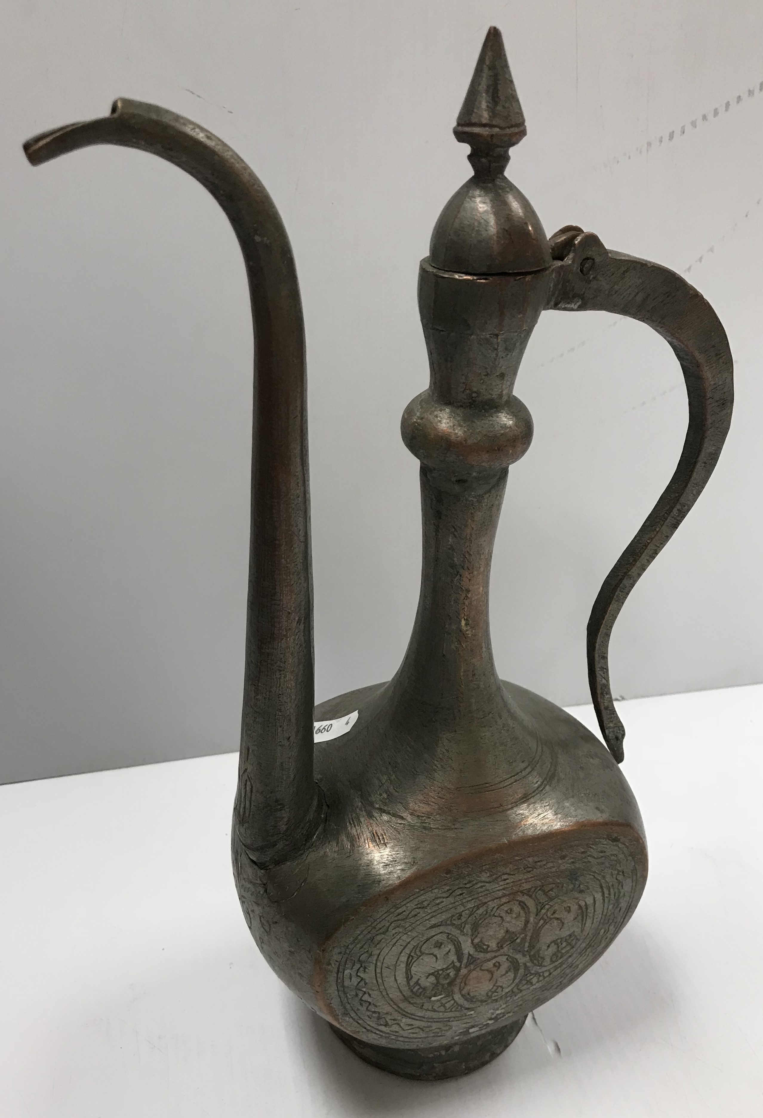 A Middle Eastern silvered coffee pot with engraved decoration, 34. - Image 3 of 5