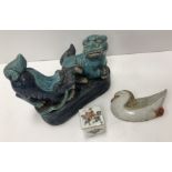 A Japanese pottery figure group depicting two dogs of Fo in blue and turquoise glaze 11 cm high