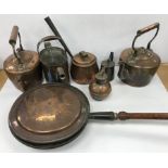 A collection of various copper ware to include a Jersey measure, wooden handled warming pan,