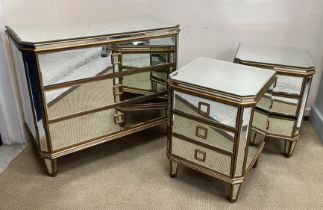 A modern mirrored and gilded chest of three long drawers on square tapered legs,