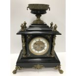 A 19th Century black marble cased and brass embellished mantel clock,