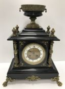 A 19th Century black marble cased and brass embellished mantel clock,