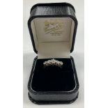 A ladies 18 carat gold and platinum set five stone diamond dress ring, approx diamond weight 1.