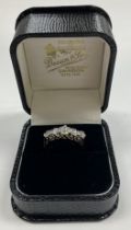 A ladies 18 carat gold and platinum set five stone diamond dress ring, approx diamond weight 1.