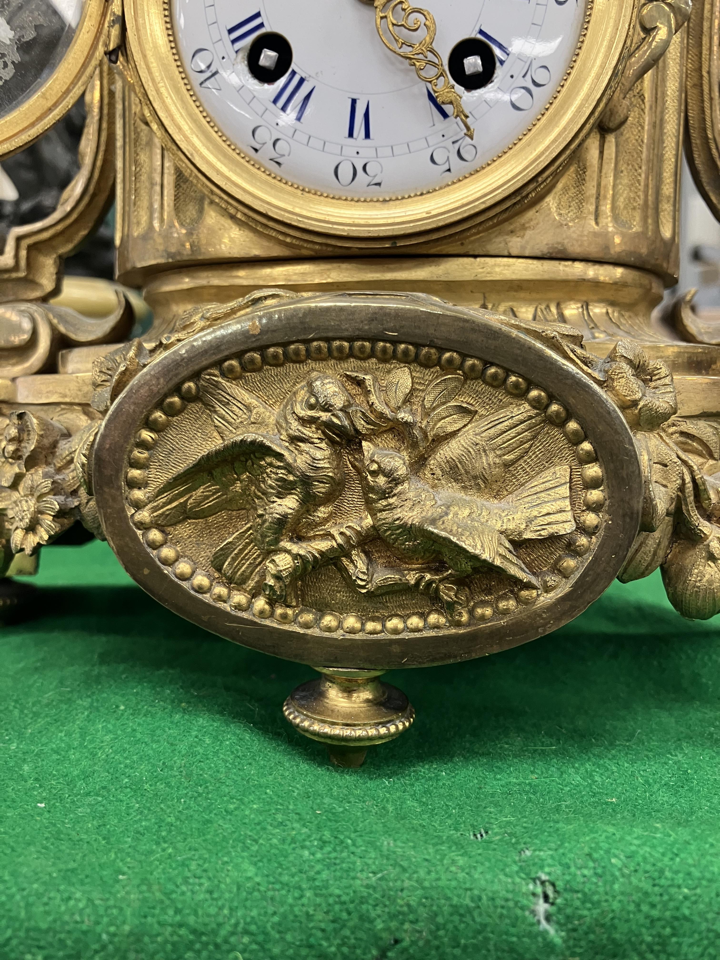 A 19th Century French gilt brass cased mantel clock, - Image 24 of 34