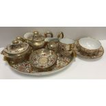 An early 19th Century Spode type gilt and polychrome decorated duet tea service comprising tray,