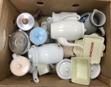 A box containing assorted Poole and other tea pots,