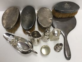 A collection of silver wares to include a George VI silver sparrow beak cream jug with engraved