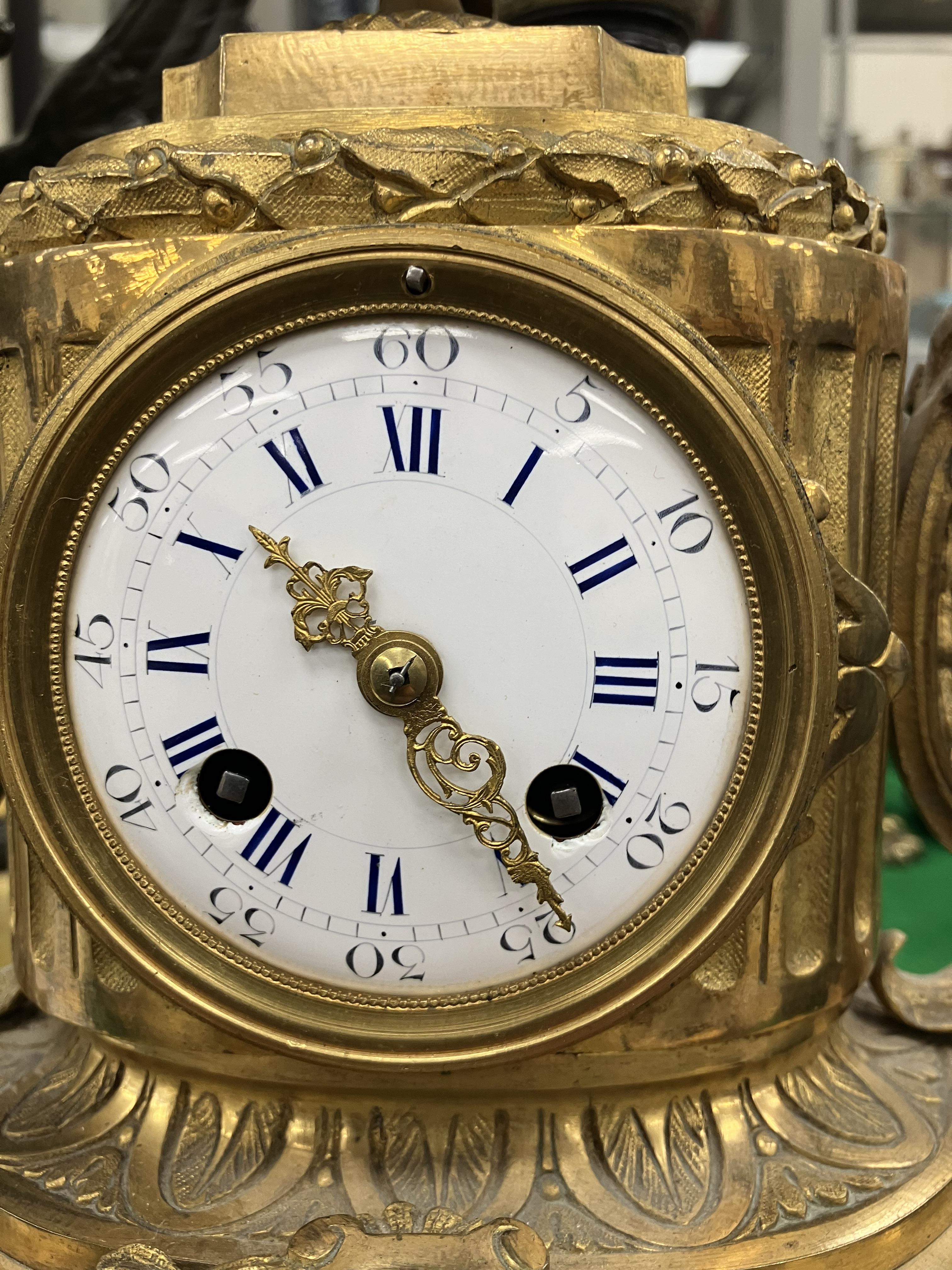 A 19th Century French gilt brass cased mantel clock, - Image 27 of 34