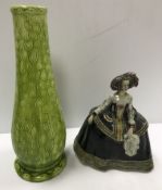 A Burmantofts faience green glazed incised baluster shaped vase on circular foot, stamped and No'd,