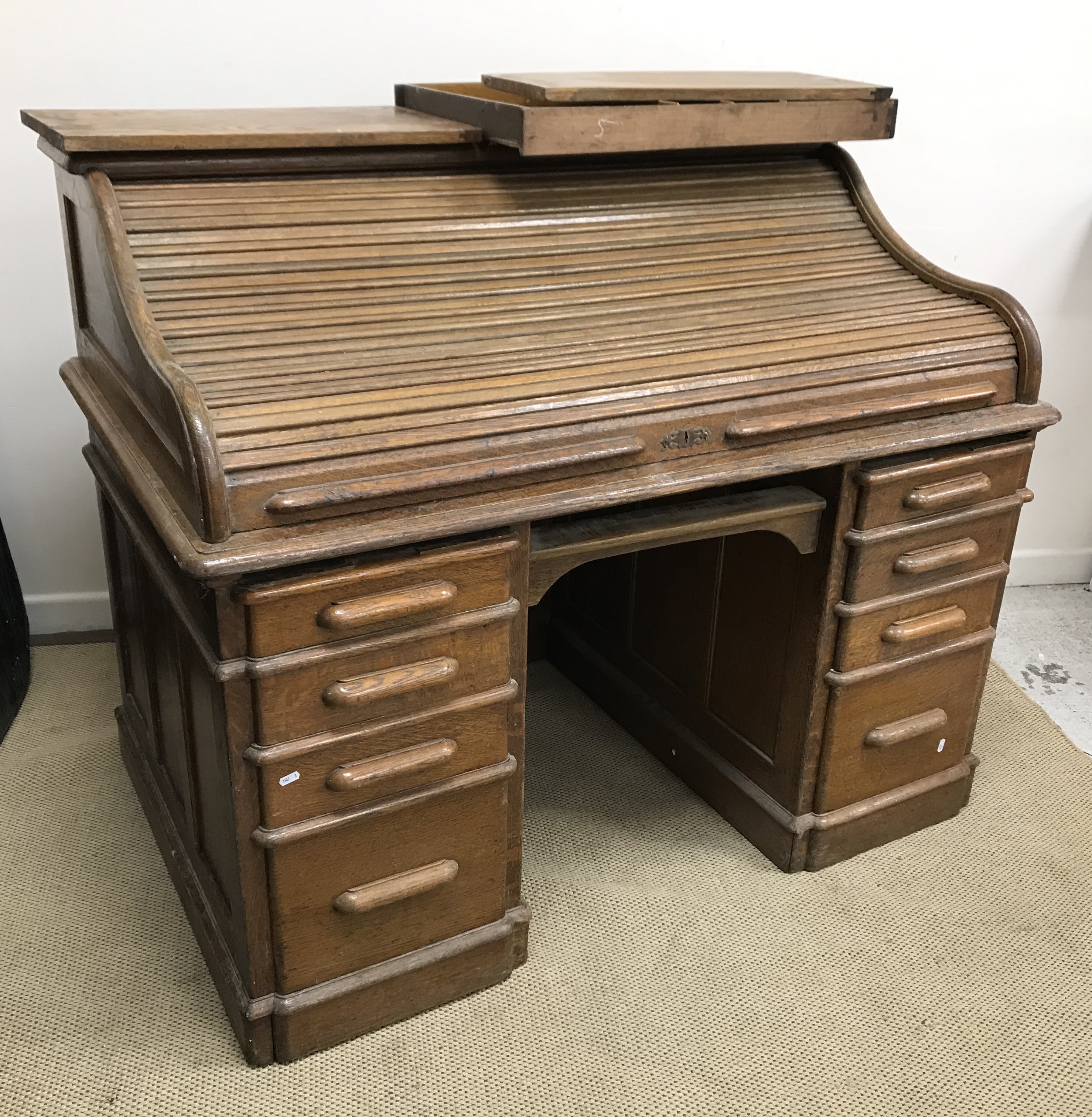 A circa 1900 American tambour or roll top desk, with basic fitted interior, over a central drawer, - Image 2 of 2