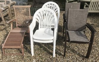 A slatted teak steamer chair, four white painted plastic chair and,