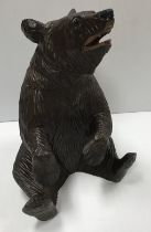 A Black Forest type carved and painted treen ware lidded box as a seated bear,