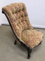 A Victorian rosewood framed buttoned scroll back salon chair on moulded cabriole legs to scroll