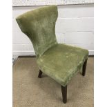 A set of twelve olive green upholstered high back dining chairs on square tapered stained beech