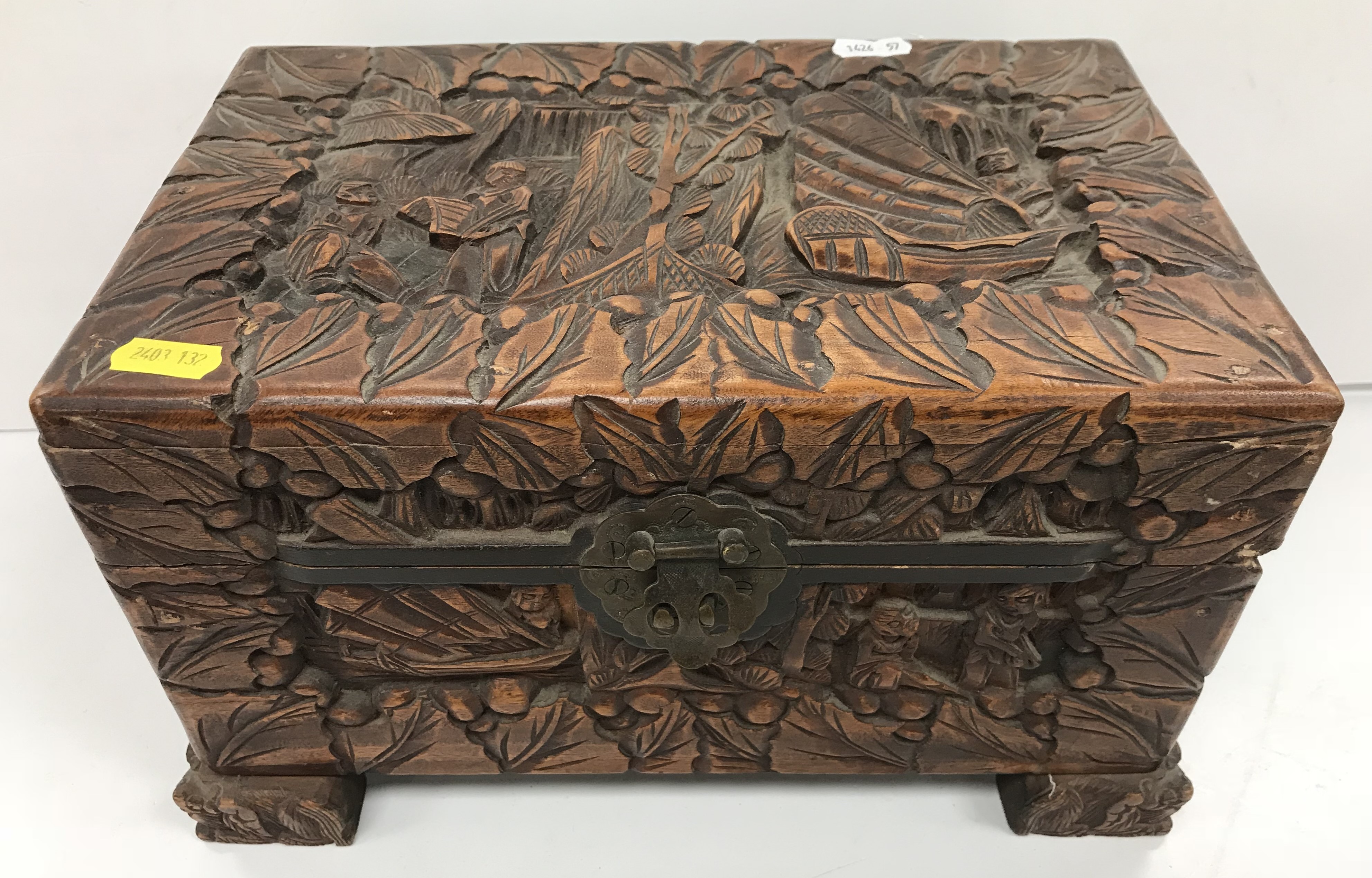 An Indonesian carved camphor wood miniature trunk with all over figural and foliate decoration - Image 3 of 8