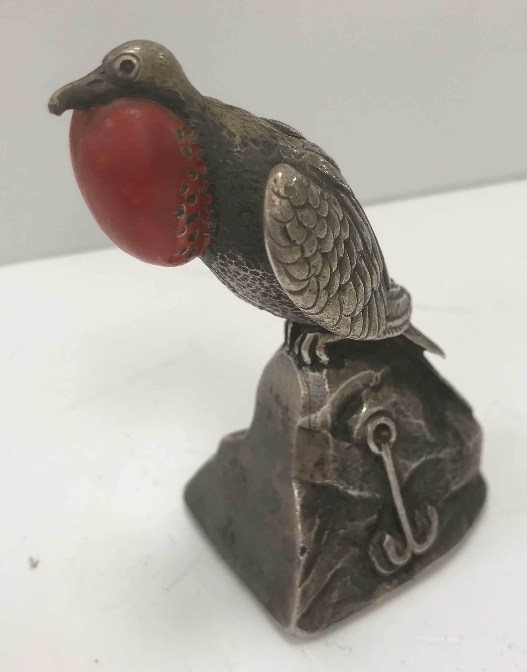 An early 20th Century white metal and enamel decorated frigate bird with throat expanded sat on a - Image 2 of 3