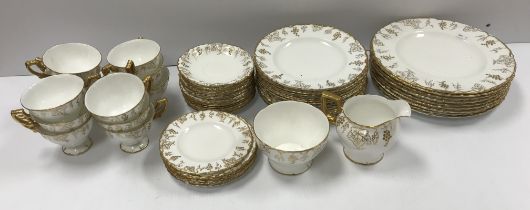 A Royal Crown Derby "Vine" pattern white glazed and gilt decorated tea set,