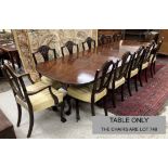 A mahogany rounded rectangular triple pillar dining table in the George III taste,