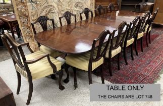 A mahogany rounded rectangular triple pillar dining table in the George III taste,