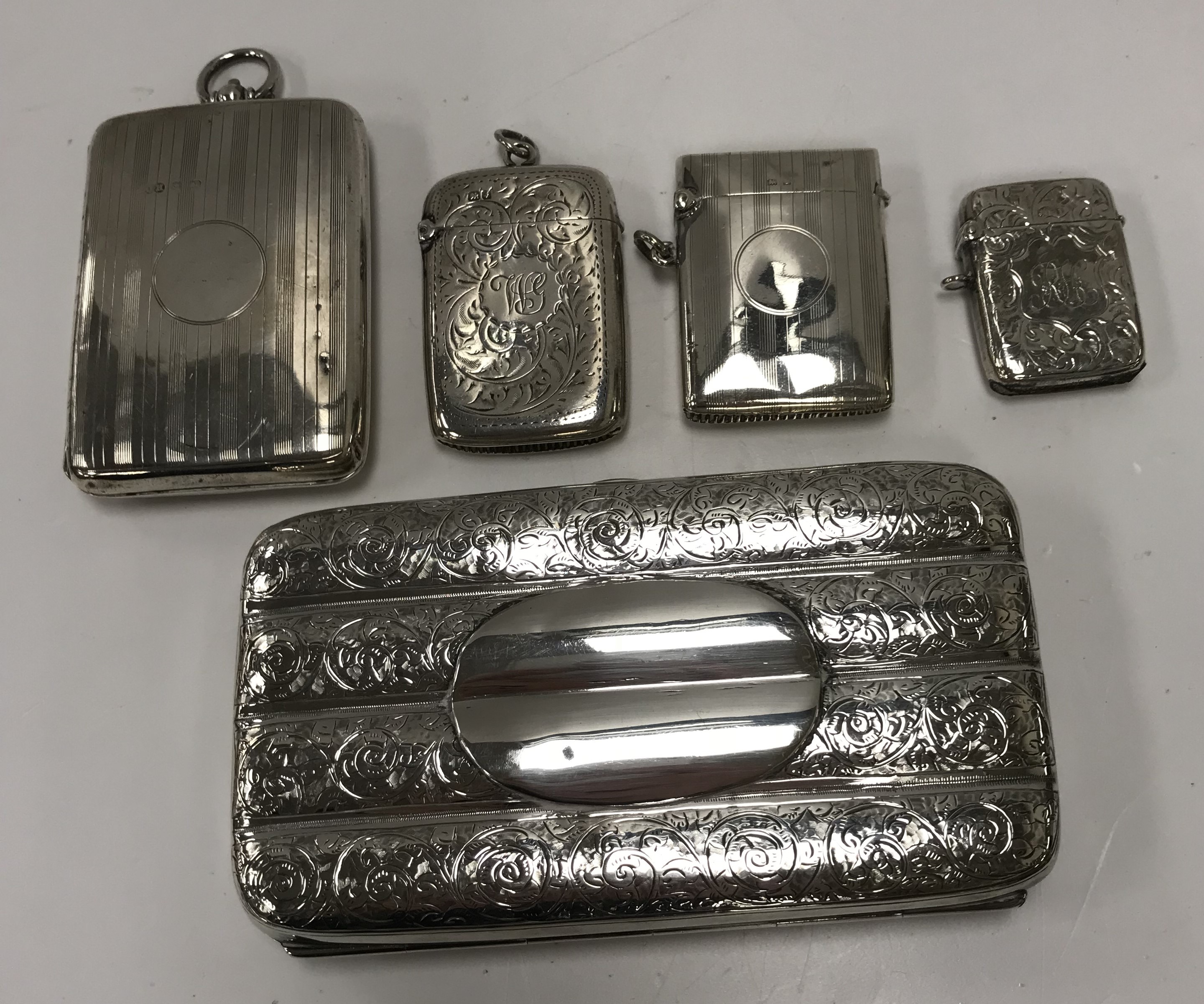 A collection of silver comprising a silver cigar case (by Henry Charles Freeman, Chester 1889),
