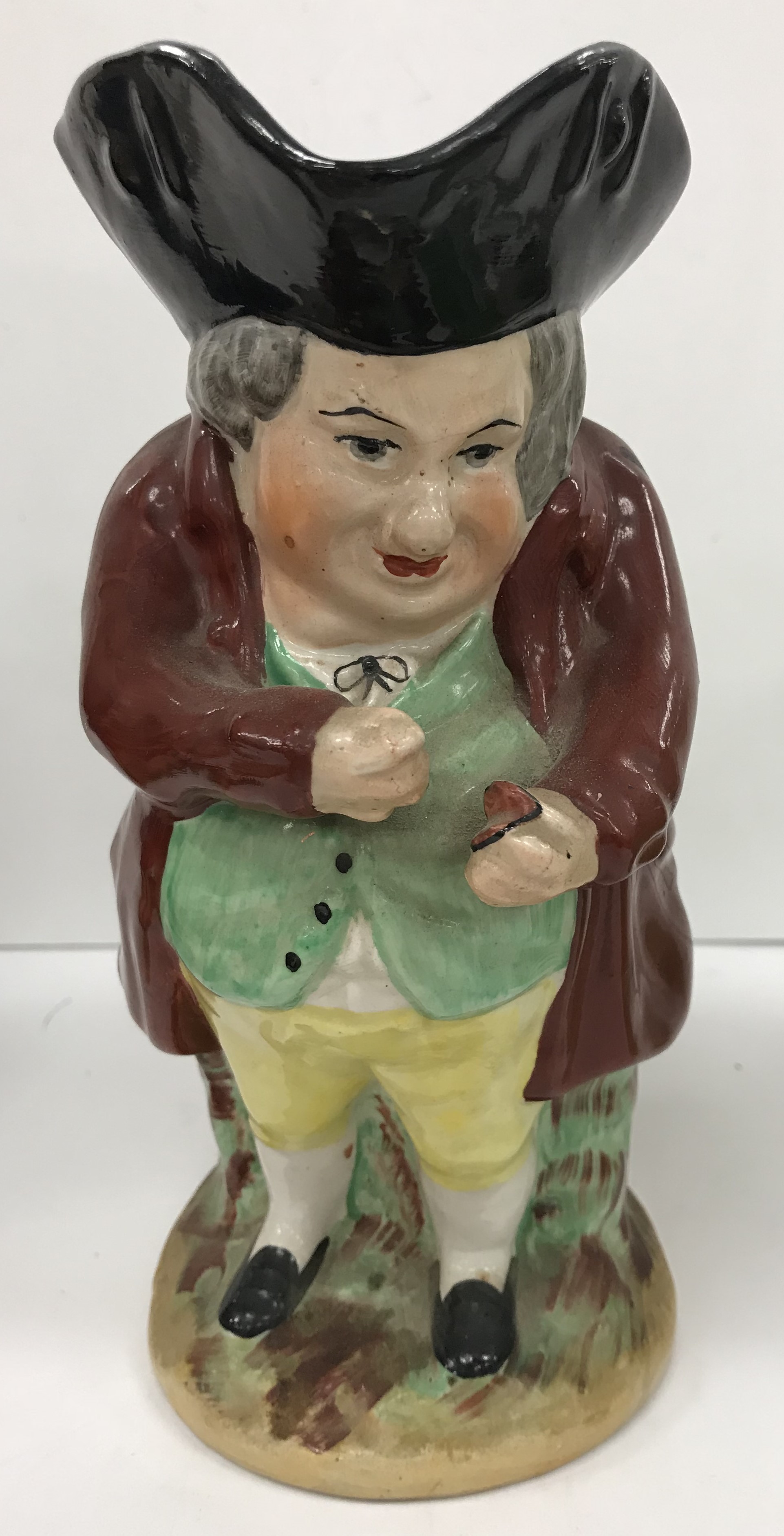 A 19th Century polychrome decorated Staffordshire figure of a "Squire Toby" as a jug, - Image 2 of 4