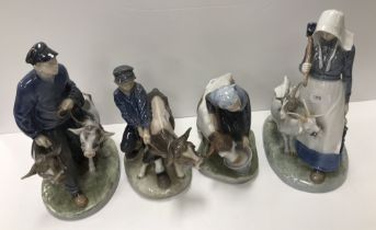 A collection of four Royal Copenhagen figures of farm labourers with cows or goats No'd 779, 772,