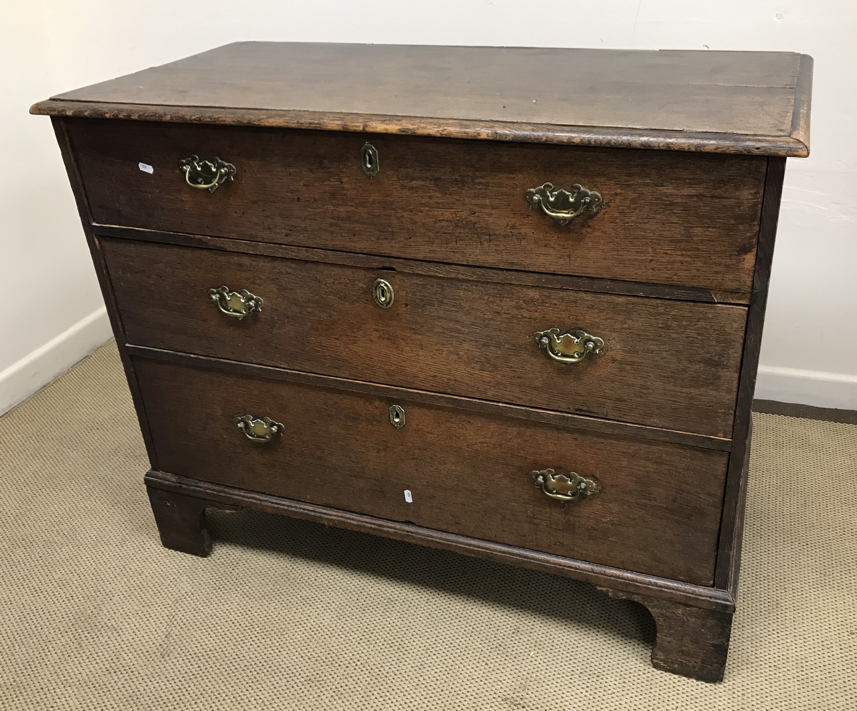 A late 18th / early 19th Century oak chest,