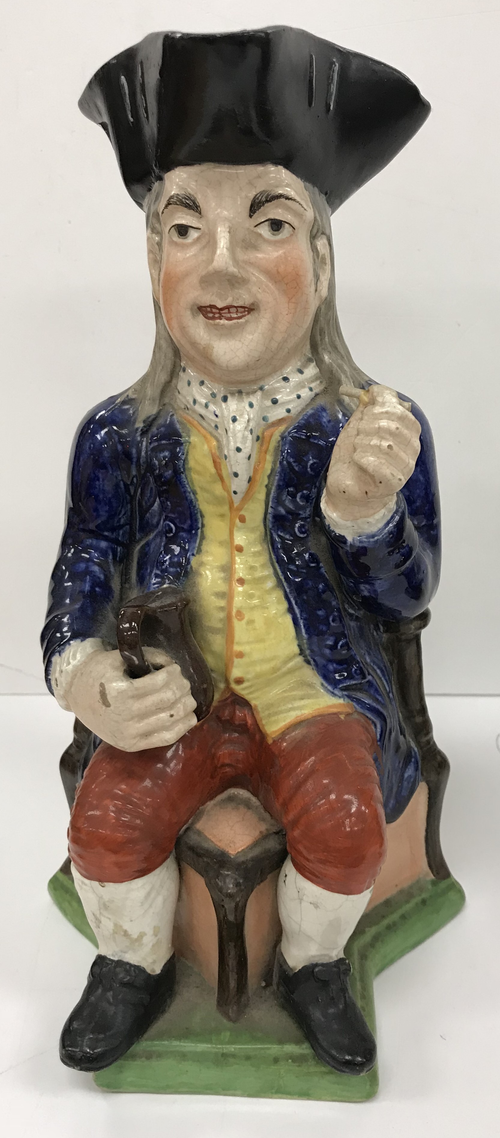 A 19th Century polychrome decorated Staffordshire figure of a "Squire Toby" as a jug, - Image 3 of 4