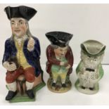 A 19th Century polychrome decorated Staffordshire figure of a "Squire Toby" as a jug,