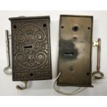 A Gibbons of Wolverhampton brass asylum type lock and key and an ornate cast iron door lock with