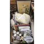 Two boxes containing various household linens and china to include a Sandersons Home throw,