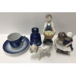 A collection of Royal Copenhagen wares to include a figure of a young boy with basket full of